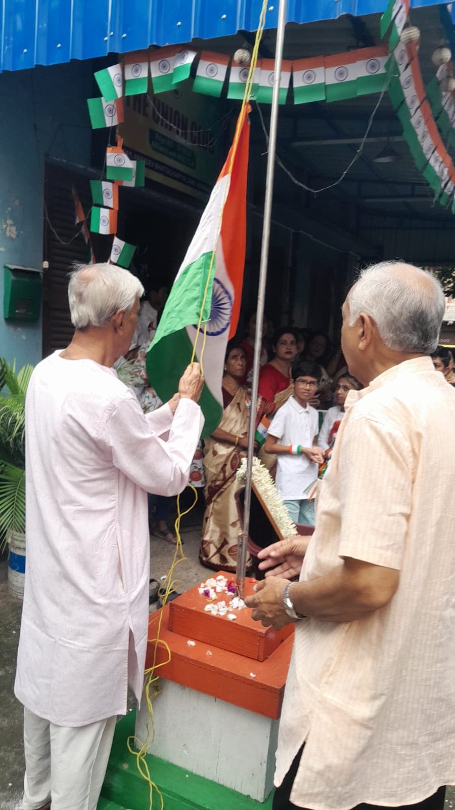 Hoisting the national flag at the club